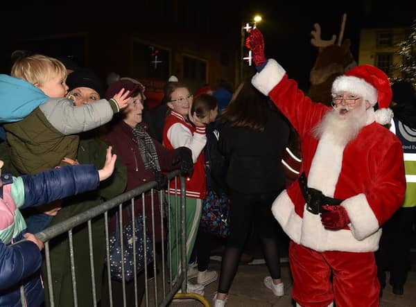 Santa makes a big entrance at the Christmas lights switch-on Portadown town centre in the run-up to Christmas 2022.  PT47-210.