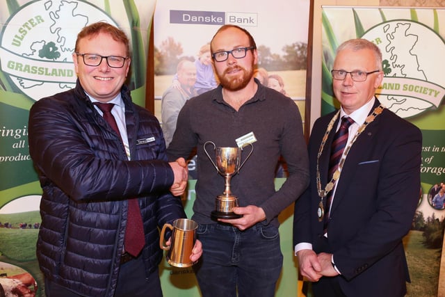 Phillip Truesdale from Castlewellan pictured receiving his Runner Up award in the Grassland Farmer of the Year competition from Mark Forsythe, Danske Bank and John Egerton, UGS.