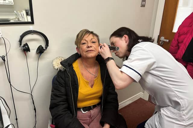 Lagan Valley’s Associate Audiologist Paula McAnulty with patient Caroline Lavery. Pic credit: SEHSCT