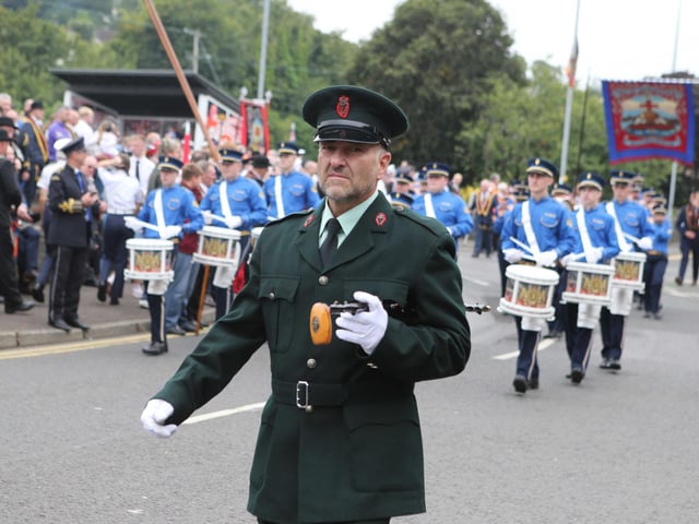 Members of Constable Anderson Memorial Flute Band step out in Larne for the 'Last Saturday' parade.