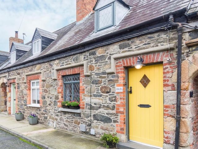 This delightful one-bedroom mid-terrace cottage is steeped in history. Thought to have been built in the late 1820s for employees of the Downshire Estate, Duncan's Cottage has been thoughtfully renovated to blend modern conveniences with historical character. This property comprises of a practical layout as well as a generously sized lounge featuring a fireplace with black granite hearth, a modern fitted kitchen, a white suite bathroom and a bedroom on the first floor. It is on the market for £229,950 with Robert Wilson estate agency group.