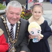 Mayor Cllr Ivor Wallace with Ellie and Poppy Martin at the King Charles III coronation big screen viewing in Coleraine town centre on Saturday