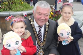 Mayor Cllr Ivor Wallace with Ellie and Poppy Martin at the King Charles III coronation big screen viewing in Coleraine town centre on Saturday
