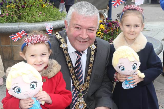 Mayor Cllr Ivor Wallace with Ellie and Poppy Martin at the King Charles III coronation big screen viewing in Coleraine town centre on Saturday