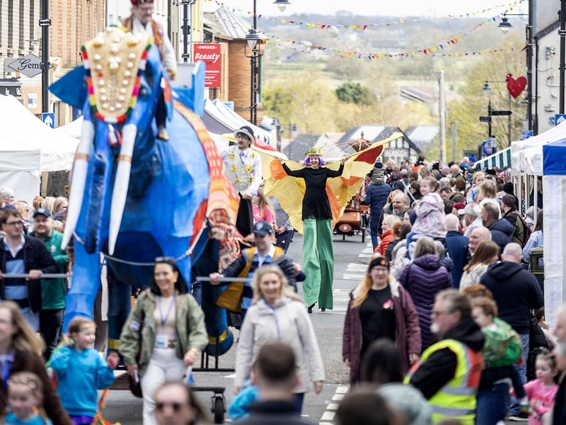 The carnival parade making its way through the town.