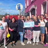 Emerge Counselling Services receives a welcome donation from Lambeg Orange and Blue Flute Band. Pic credit: Emerge Counselling Services