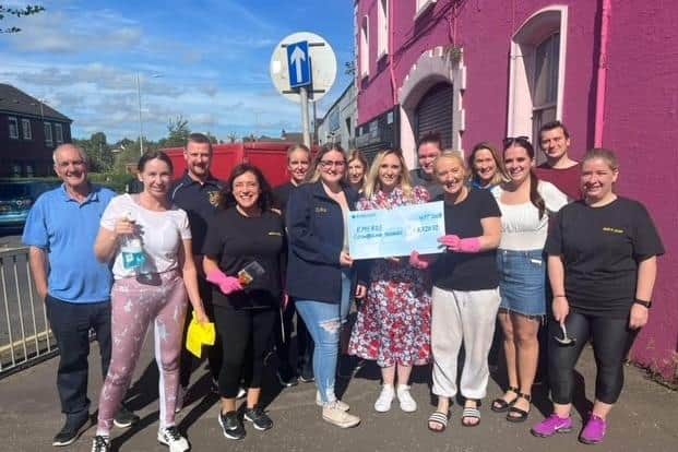 Emerge Counselling Services receives a welcome donation from Lambeg Orange and Blue Flute Band. Pic credit: Emerge Counselling Services