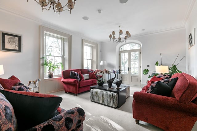 The stylish drawing room  (20'7" x 14'7") has twin sliding sash windows to the rear elevation. It featues a built-in speaker system to ceiling, hardwood double glazed French doors, with matching fan light, leading to the patio area.