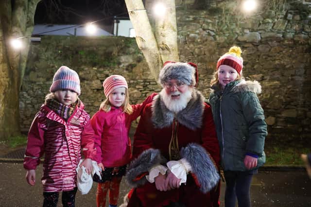 Zoe, Amy and Sophie Lonton with Santa