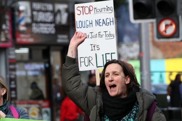 Environmental campaigners marched through Belfast to demand action on the ecological crisis at Lough Neagh.