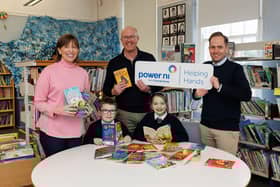 Pictured (L-R) is Gwyneth Compston of Power NI, Colin Devine and Max Burns of Strandtown Primary, and pupils of Strandtown Primary School.