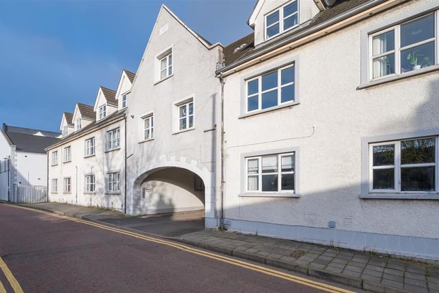 The first floor, duplex apartment is conveniently located in the heart of Carrickfergus, within walking distance to the marina, shops and other amenities of the town.