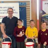 ​Parents Colin and Lyndsay with Edenderry Primary School pupils, Alexander, Archie and Jude.