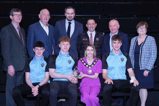 St Mary's Grammar School, Ulster Hurling Champions, receive their award from Chair of the Council, Councillor Córa Corry with nominating councillors Sean McPeake, Brian McGuigan, Martin Kearney and Christine McFlynn.