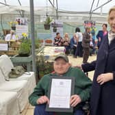 Coleraine not-for-profit organisation Ashes to Gold was presented with the King's Award for Volunteering by His Majesty's Lord Lieutenant for County Londonderry, Alison Millar, at a ceremony on March 27. The Lord Lieutenant is pictured with Stefan Darragh.