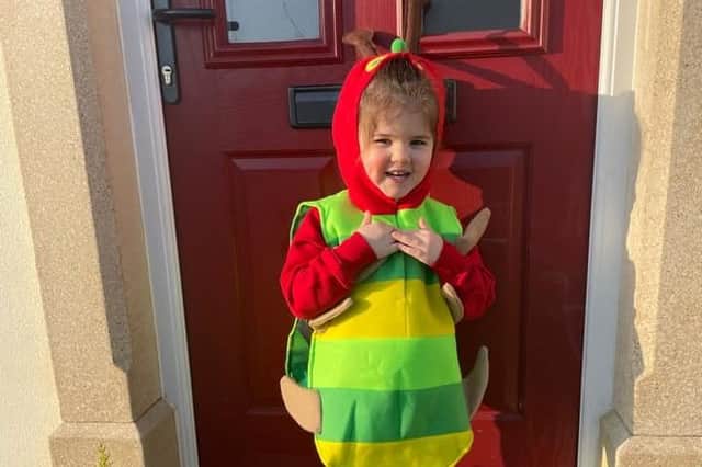 Three year old Elena Dean from Ladybird Lane Day Preschool as The Very Hungry Caterpillar.