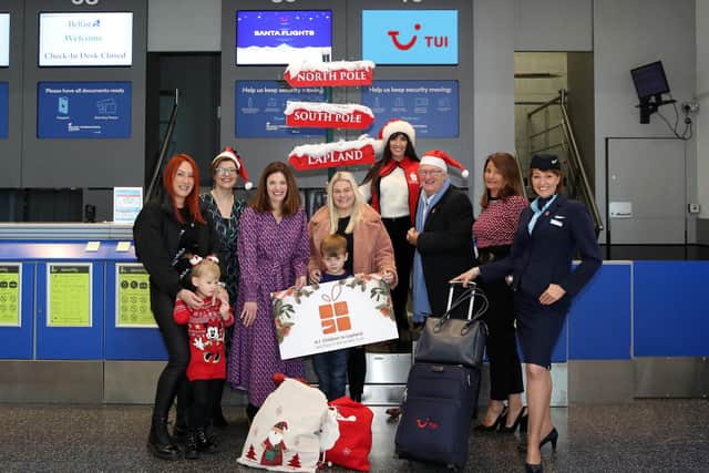 Pictured are (l-r) Karen Toal and daughter Rionach Johnston; Deborah Harris, PR & Marketing Manager, Belfast International Airport; Charlotte Brenner, Marketing Manager, TUI Ireland; Carlee Beattie and son Carter; Fiona Williamson, General Manager and Colin Barkley, Chair, Northern Ireland Children to Lapland and Days to Remember Trust; Jean Foster, General Manager, Swissport, Belfast; and Karen Walker, Crew, TUI.  Photo: NICLT
