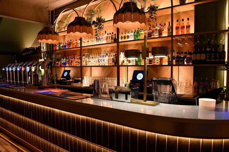 At the new Maisie's Bar and Restaurant there is a well stocked bar in a cool art deco design. PT49-220.