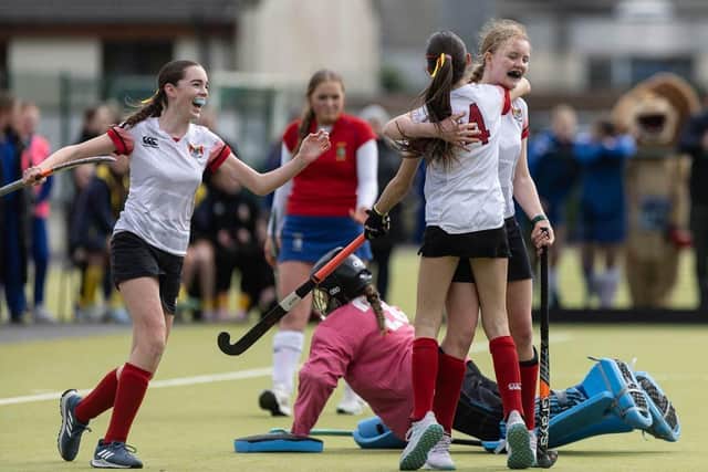 Mya Kennedy, Mollie Tumilty and Casey Cousins celebrate.