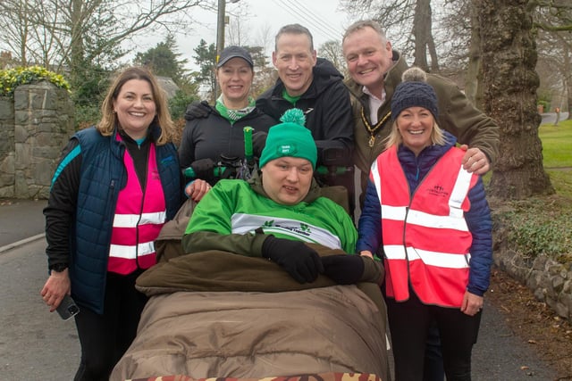 Aaron Kerr, front centre, is a well known face in the local running world. He is pictured with his parents, Sandra and David at the Portadown Running Festival and from left, Janine Maher, race director, Kyle Savage, Deputy Lord Mayor, ABC Council and Natalie Bowbanks, race committee. PT12-219.