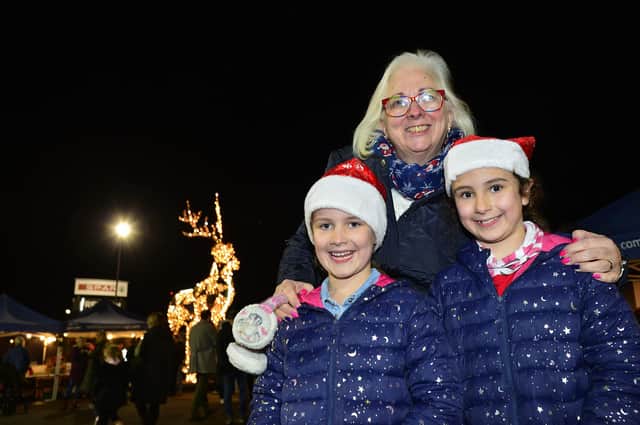 Lisburn and Castlereagh City Councillor Hazel Legge and her granddaughters at the Christmas Market in Dundonald