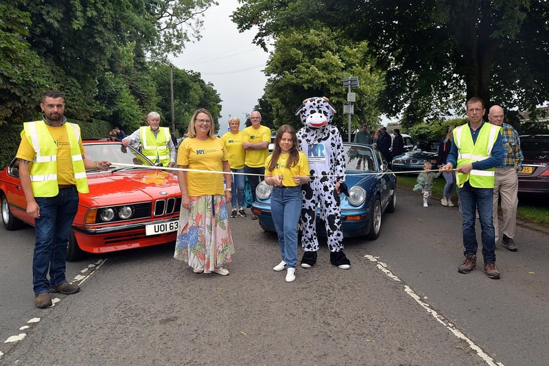 Cutting the tape to launch the annual Waringstown Vintage Cavalcade on Friday is kidney transplant recipient, Megan Raynor. The annual event is a fundraising vehicle for the NI Kidney Research Fund. LM27-216. Photo by Tony Hendron