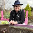 Donaghcloney man Walter Ferris pictured with his food caddy at the Donaghcloney Community Garden where compost made from food waste is used to grow vegetables. Picture: ABC BC.