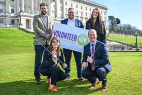 Pictured standing L-R are Jonathan McCarron, Causeway Coast & Glens Council; Marc Scott, Volunteer Now Chair; Eimear Hone, Tourism Northern Ireland along with Economy Minister Caoimhe Archibald and Minister for Communities Gordon Lyons.  CREDIT VOLUNTEER NOW