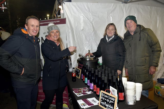 Angus Graham and Lyndsey Greenlee, left, try out some mulled wine at the Portadown Twilight Market courtesy of stall holders, Sandy Weinert and Peter Murray. PT47-209.