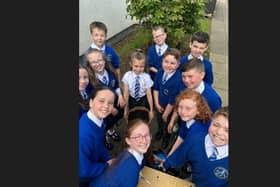 Children from P5 and P6 at St Mary's Primary School, Derrytransa get to grips with gardening with a little help from Portadown Wellness Centre's Alan McDowell.