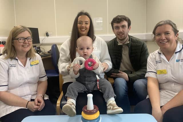 Paediatric Lead Audiologist, Lisa Robinson, Kirsty and little Kade with dad Kyle and South Eastern Trust, Ulster Hospital Paediatric Lead, Clare Snaith. Pic credit: SEHSCT