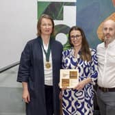 Roisin (centre) and Martin (right) of Marshall McCann Architects receiving the RIAI Award 2023 for Sustainability for their design, Silver Bark house, from President of the RIAI, Charlotte Sheridan. Credit Conor Healy / Picture It Photography