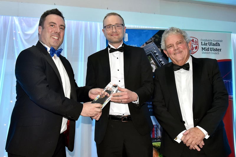 Best New Businesses Award,  presented by Rhyan McCoy, left, Owner of Hampton Roast Coffee to Oliver Boyd of Advanced Security Distribution. Also included id compere, Adrian Logan. MU46-220.