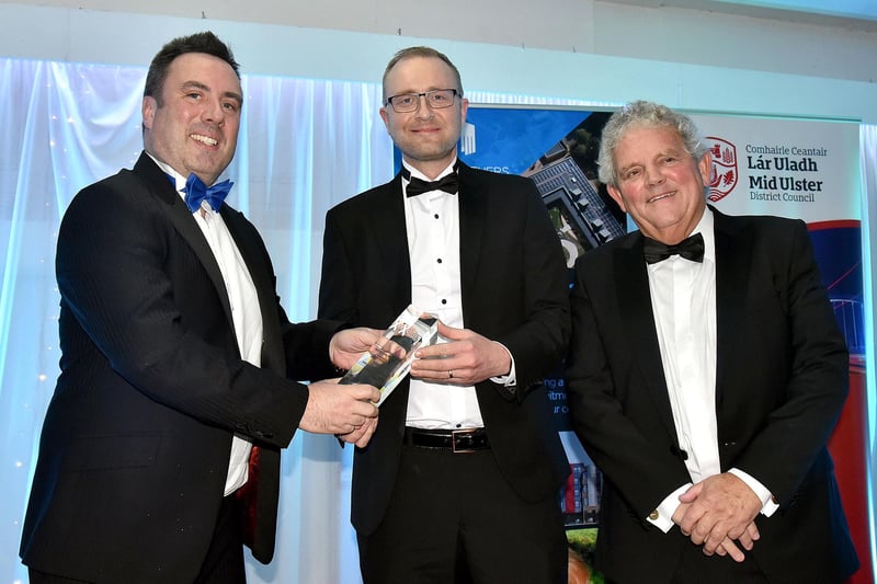 Best New Businesses Award, presented by Rhyan McCoy, left, Owner of Hampton Roast Coffee to Oliver Boyd of Advanced Security Distribution. Also included id compere, Adrian Logan. MU46-220.