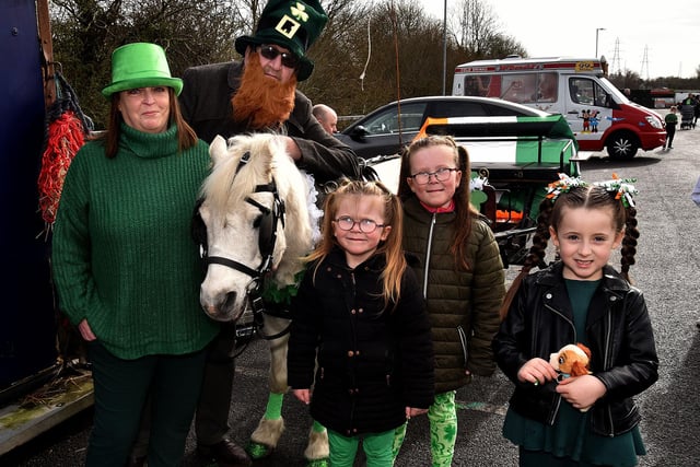 Paula Scott and Martin Tierney of Rockmore Unicorns, provided the pony and trap to carry St Patrick in the St Paul's parade on Friday and Winter the pony was very popular with the children including from left, Lacey O'Neill (6), Louise O'Neill (8) and Hollie Haughain. LM12-206.
