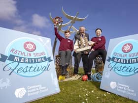 Mayor of Causeway Coast and Glens, Councillor Ivor Wallace with Riley Morris and Maia Kinney, Head Boy and Head Girl of Ballycastle Integrated PS, at the launch of Rathlin Sound Maritime Festival 2023.
