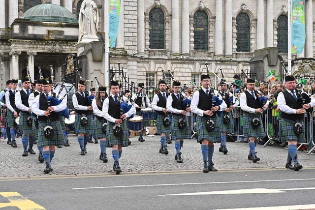 A pipe band playing outside Belfast City Hall.