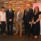 Presenter Stephen Watson and David Burns, Chief Executive, Lisburn and Castlereagh City Council, with guests at the fund-raising dinner
