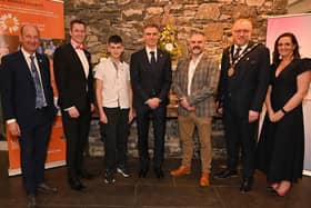 Presenter Stephen Watson and David Burns, Chief Executive, Lisburn and Castlereagh City Council, with guests at the fund-raising dinner