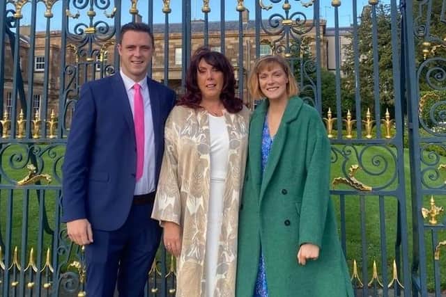 Kate with her children at Hillsborough Castle to receive the BEM. Pic credit: SEHSCT