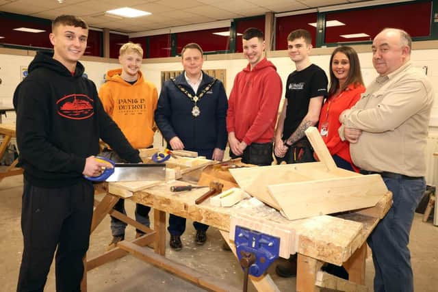 The Mayor of Antrim and Newtownabbey, Councillor Mark Cooper, with Rutledge operations manager, Charlene Bailie; joinery manager, John Woods and apprentices. Submitted by Antrim and Newtownabbey Borough Council