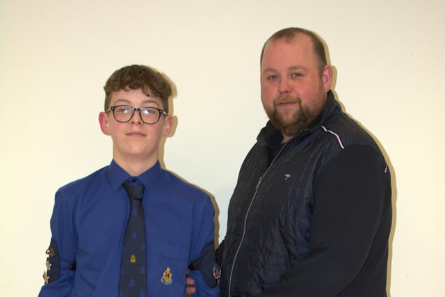 Cameron Morrison receiving his President's badge from his dad.