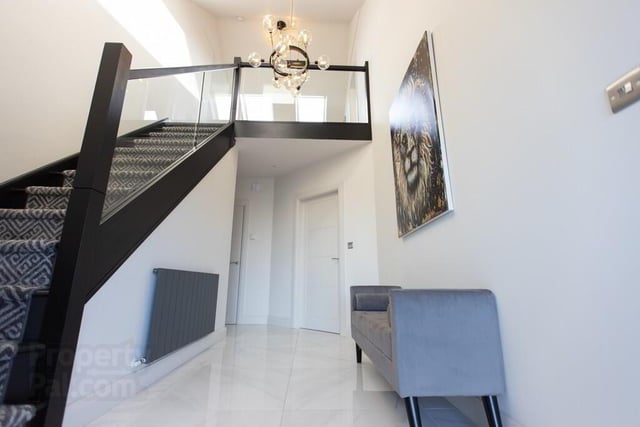 The attractive entrance space and staircase are filled with natural light.