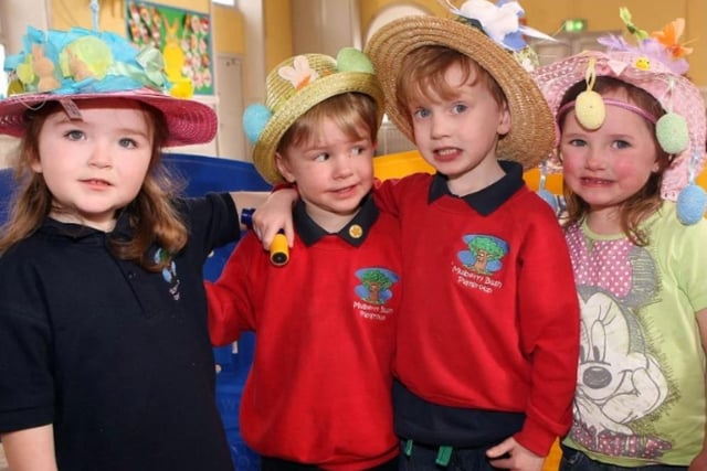 Izzie Burrows, Matthew Acheson, Ewan Russell and Zoe Moore with their Easter Bonnets in the Mulberry Bush Playgroup party at Carnmoney Presbyterian Church in 2014.
