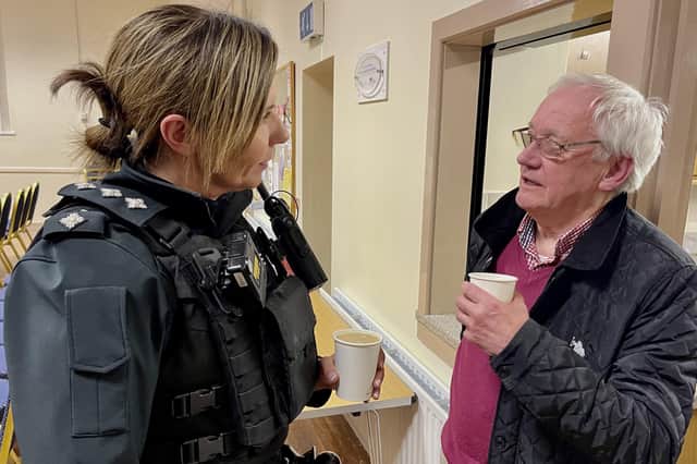PSNI Chief Inspector Cummings and Lisnagunogue Neighbourhood Watch Coordinator Morris McCurdy chat over a cuppa