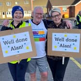 Alan Mitchell pictured with some of his supporters at the end of his marathon January. Credit: Supplied