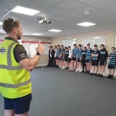 Year 11 students from Drumglass High School are welcomed during their visit to Mallaghan headquarters. Credit: Mallaghan