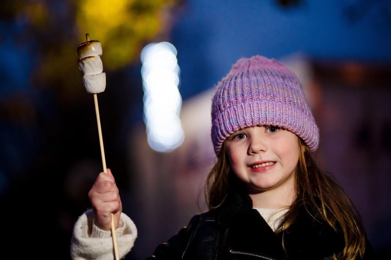 Aoife toasts a marshmallow at Glengormley Christmas celebrations.