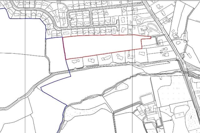 A site map with the proposed area of development outlined in red.