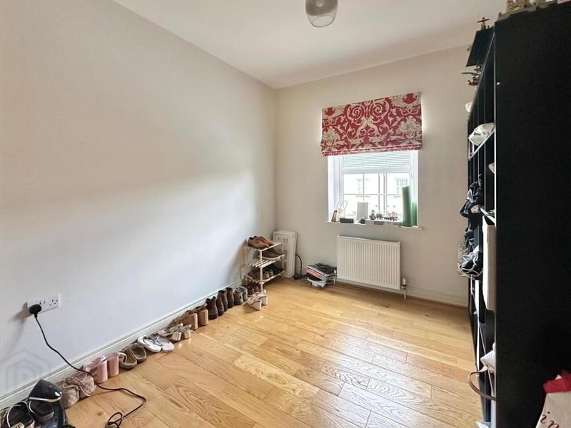Bedroom with solid wood floor.